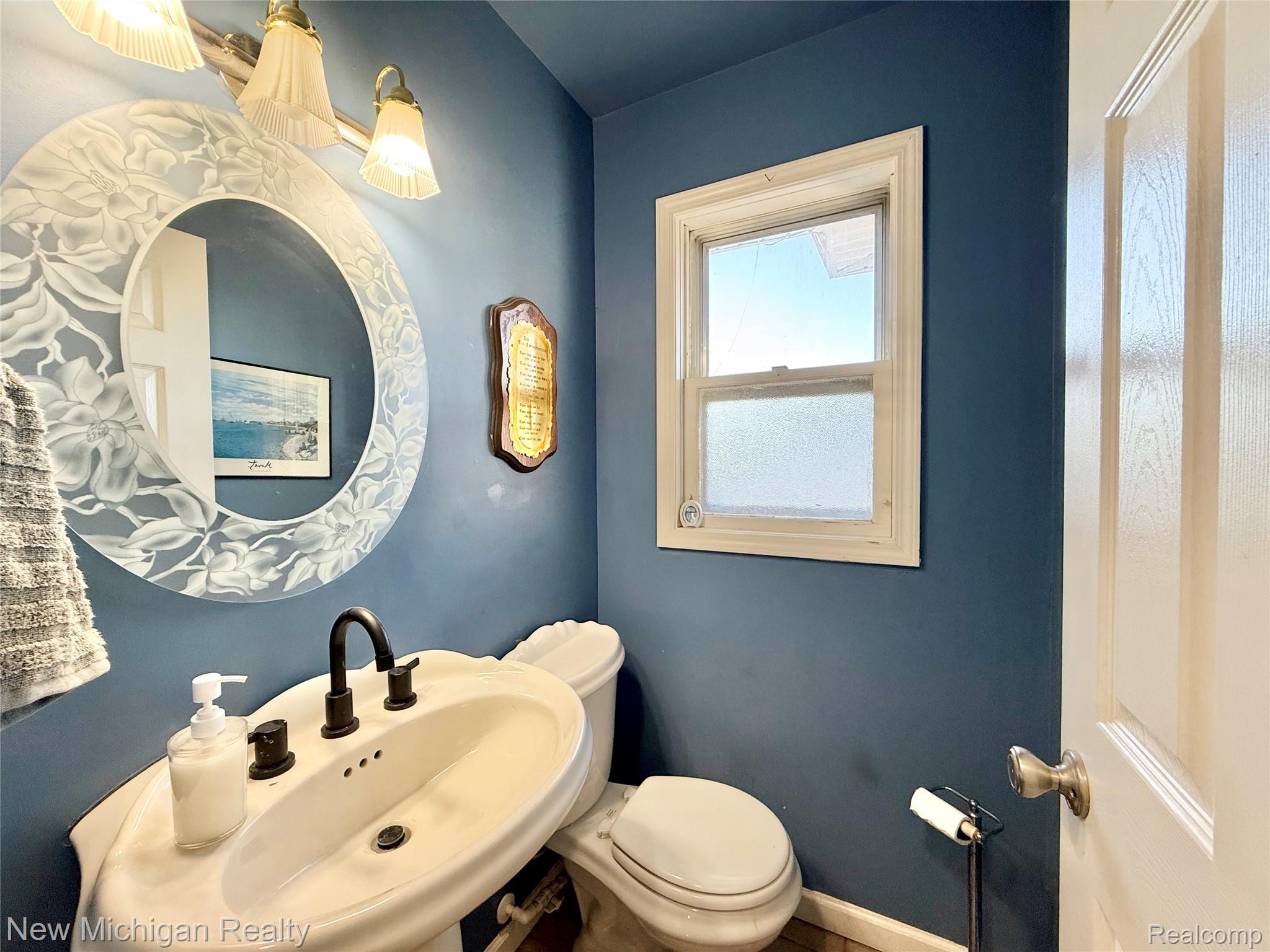 5288 Torrey Road Flint, MI 48507 - Photo 18 of 41 Bathroom featuring toilet and a sink