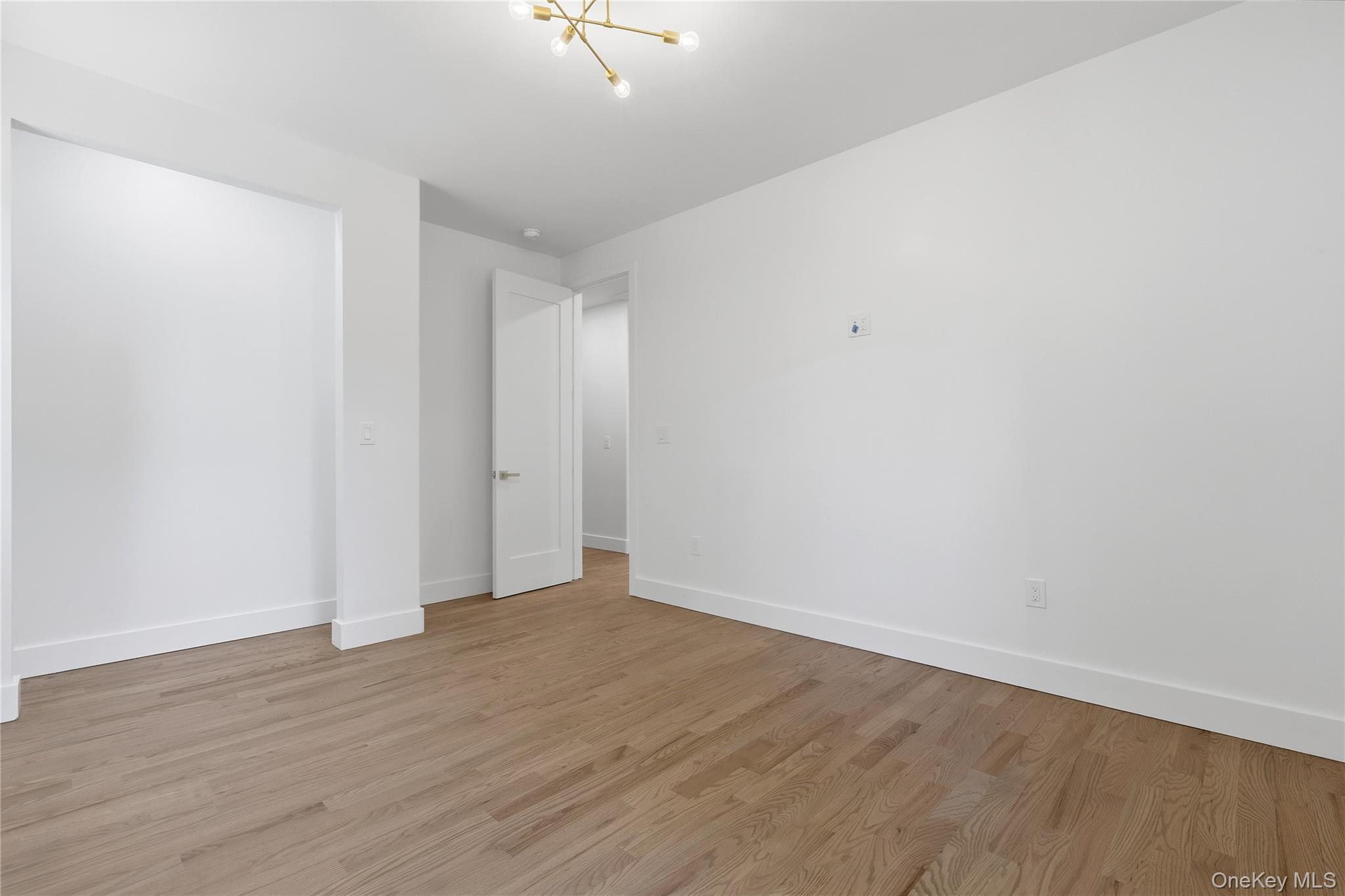 548 Lakes Road Monroe, NY 10950 - Photo 33 of 50 a view of an empty room with wooden floor