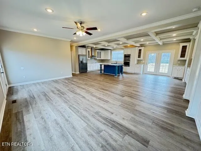 a view of livingroom with hardwood floor and ceiling fan
