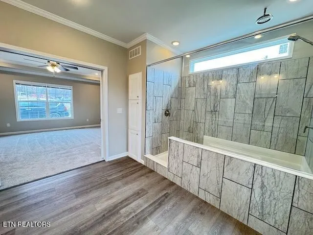 a view of an entryway with wooden floor and door