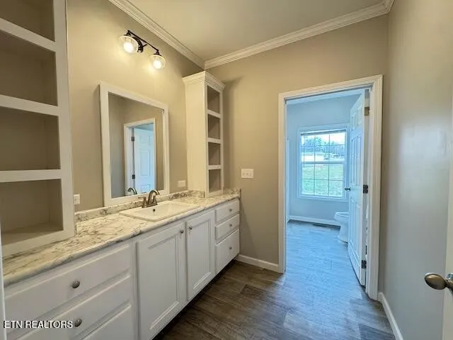 a bathroom with a double vanity sink and mirror with shower
