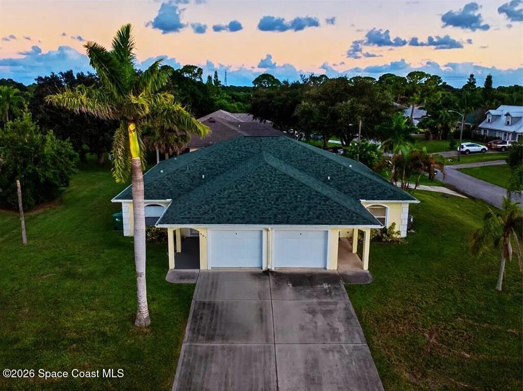 361 Del Monte Road, Unit B Sebastian, FL 32958 - Photo 1 of 23 a view of a house with a yard