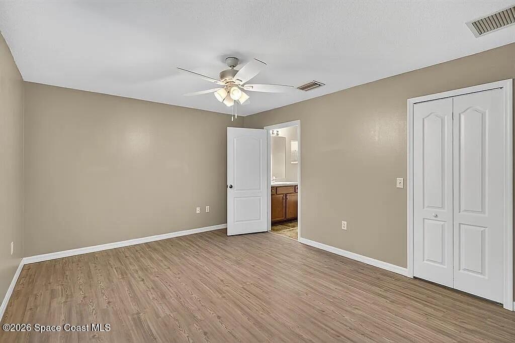 361 Del Monte Road, Unit B Sebastian, FL 32958 - Photo 12 of 23 a view of an empty room with wooden floor