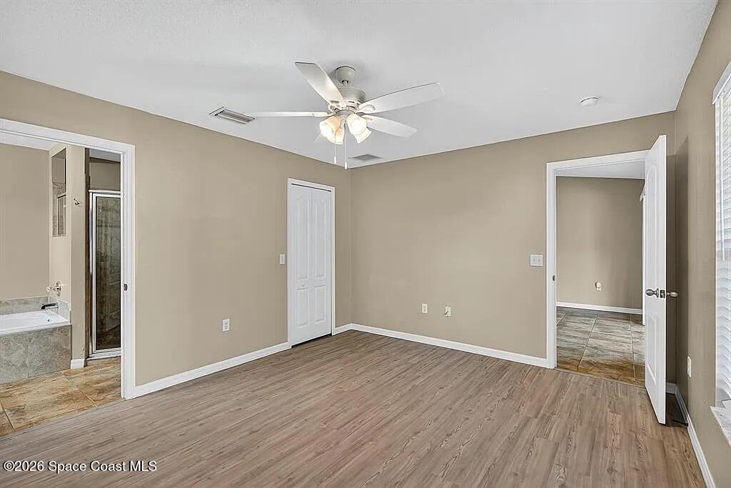 361 Del Monte Road, Unit B Sebastian, FL 32958 - Photo 17 of 23 a view of an empty room with wooden floor