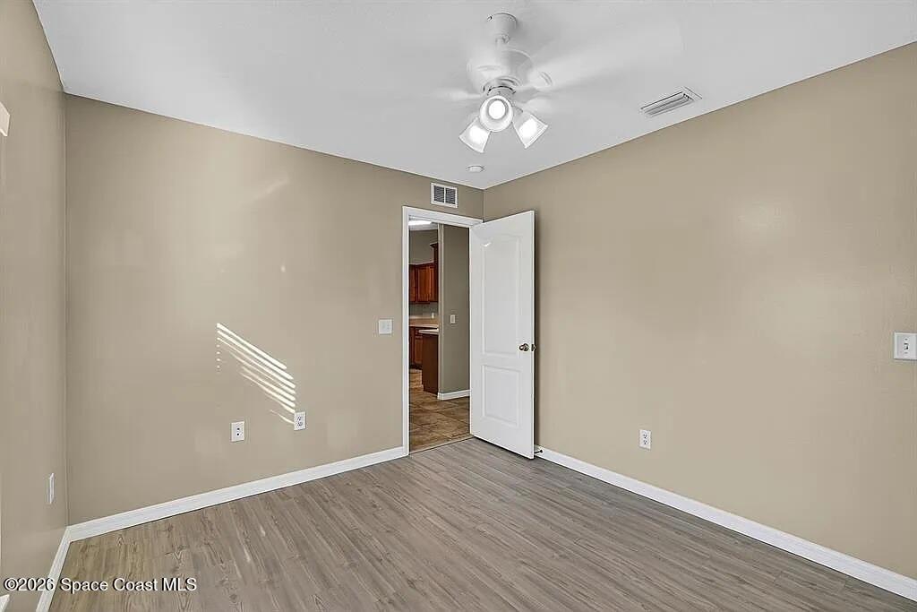361 Del Monte Road, Unit B Sebastian, FL 32958 - Photo 18 of 23 a view of an empty room with closet and a window