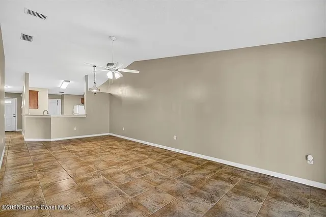 a view of a kitchen with a sink and a window