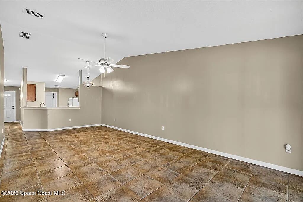 361 Del Monte Road, Unit B Sebastian, FL 32958 - Photo 3 of 23 a view of a kitchen with a sink and a window