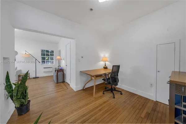 a workspace with furniture and wooden floor