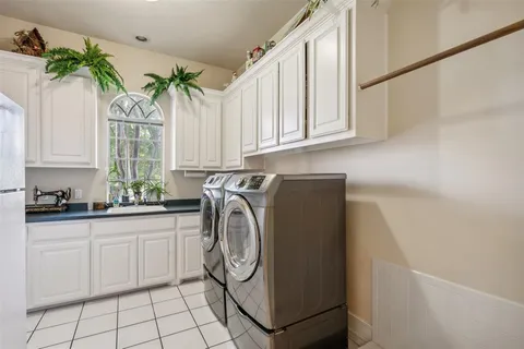 a work room with furniture and a chandelier