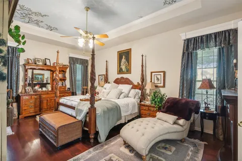 a en suite bathroom with a sink mirror and window