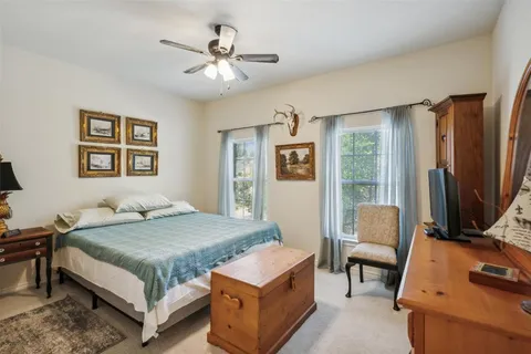 a bathroom with a shower a sink and a mirror