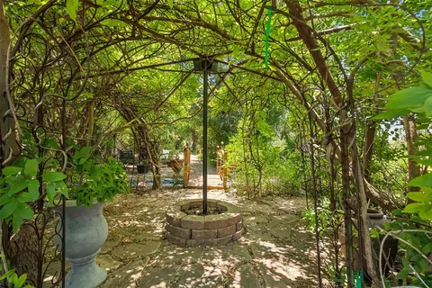 a view of a backyard with sitting area