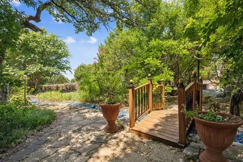a view of a backyard with sitting area