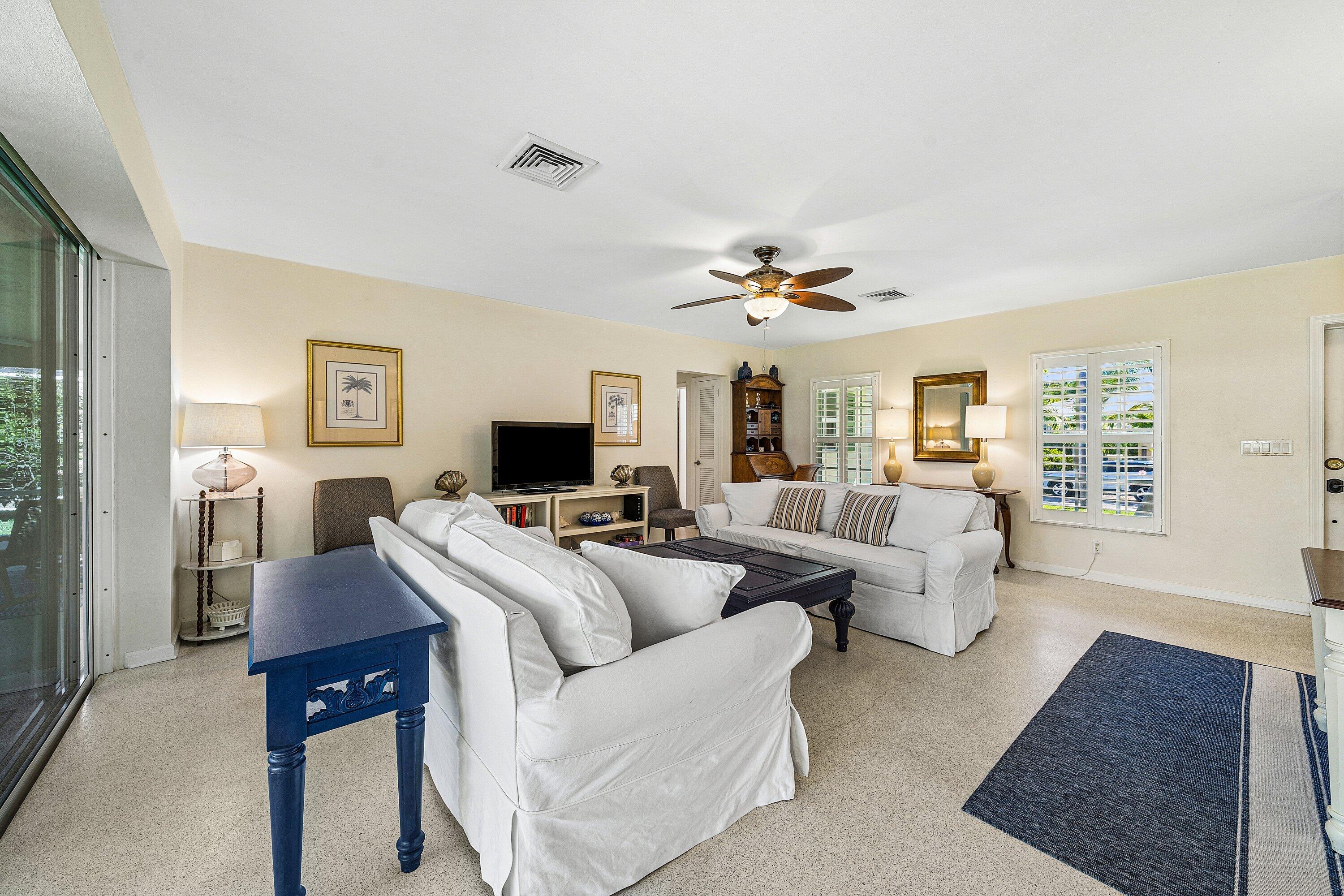 5550 Osprey Drive Ocean Ridge, FL 33435 - Photo 11 of 44 a living room with furniture and a flat screen tv