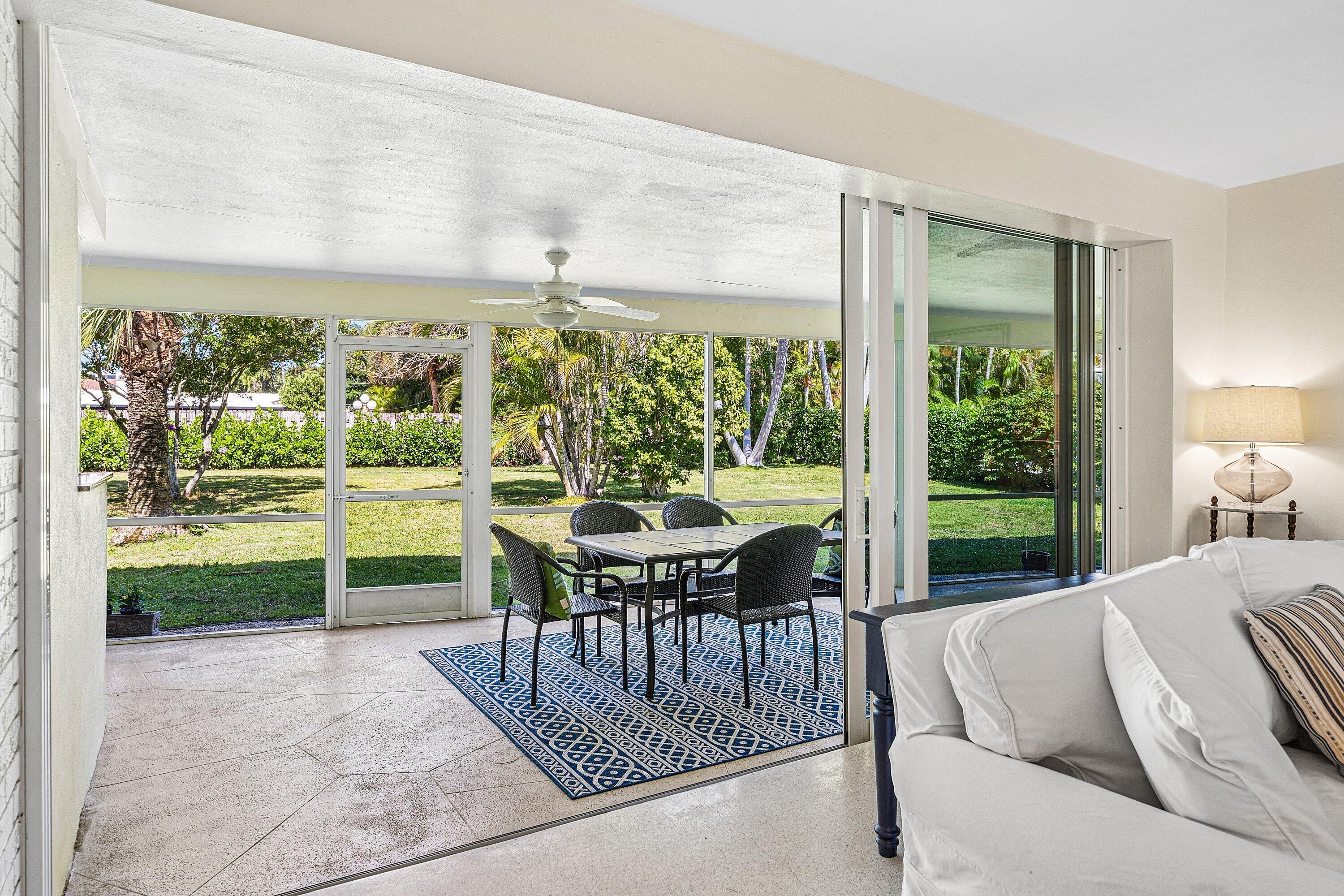 5550 Osprey Drive Ocean Ridge, FL 33435 - Photo 12 of 44 a view of a porch with furniture and garden