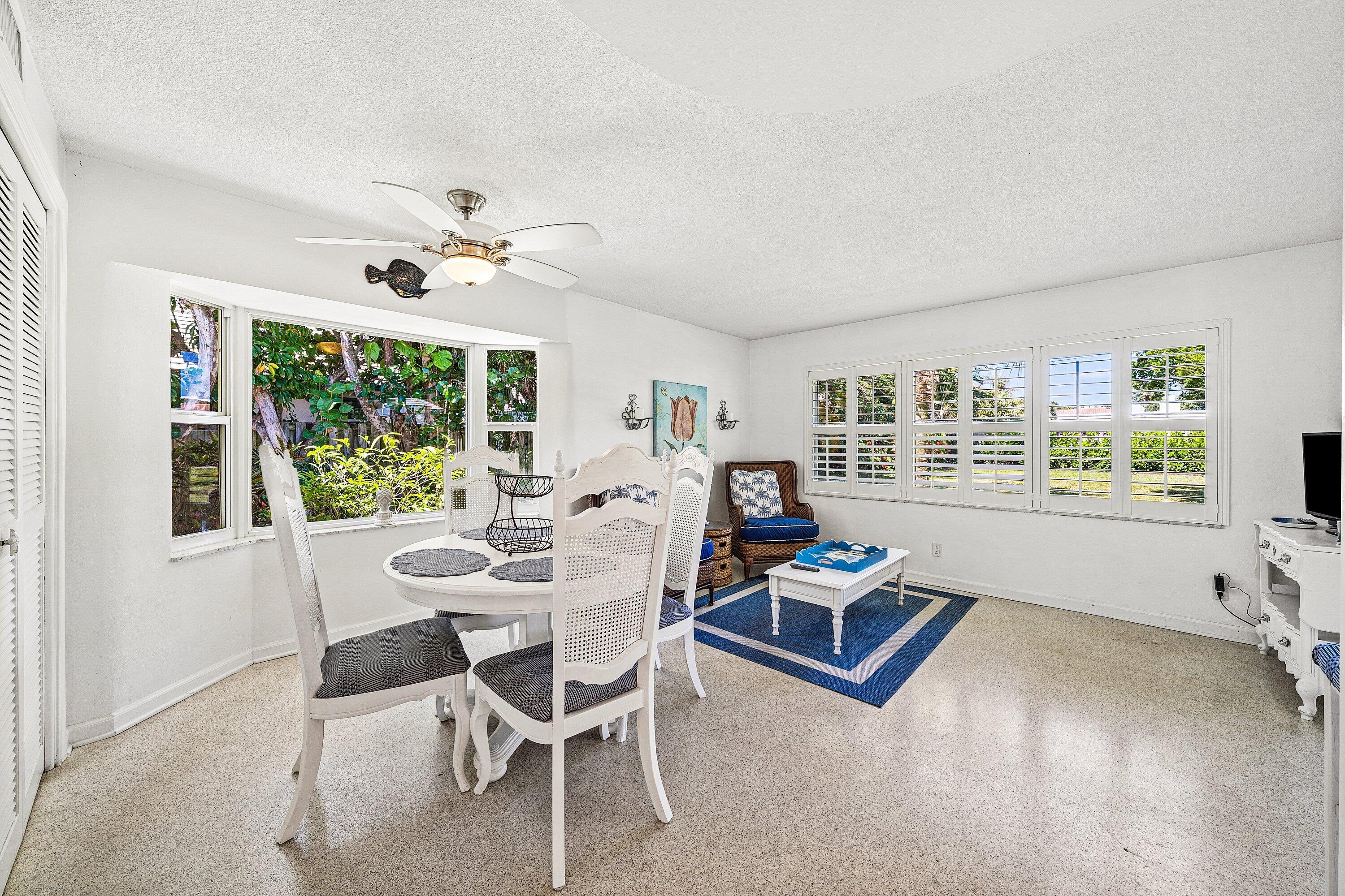 5550 Osprey Drive Ocean Ridge, FL 33435 - Photo 18 of 44 a living room with furniture and a large window