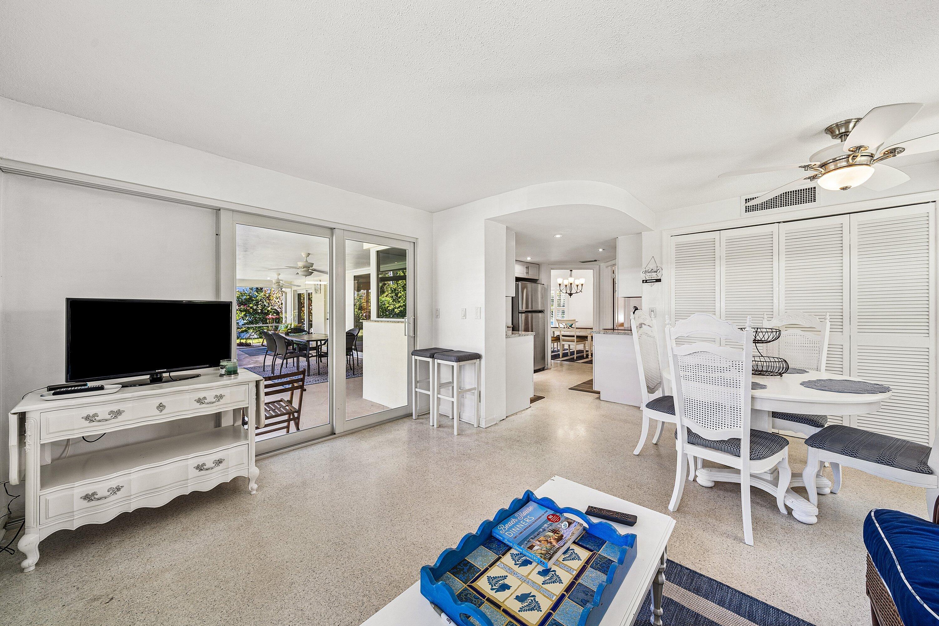 5550 Osprey Drive Ocean Ridge, FL 33435 - Photo 20 of 44 a living room with furniture and a flat screen tv