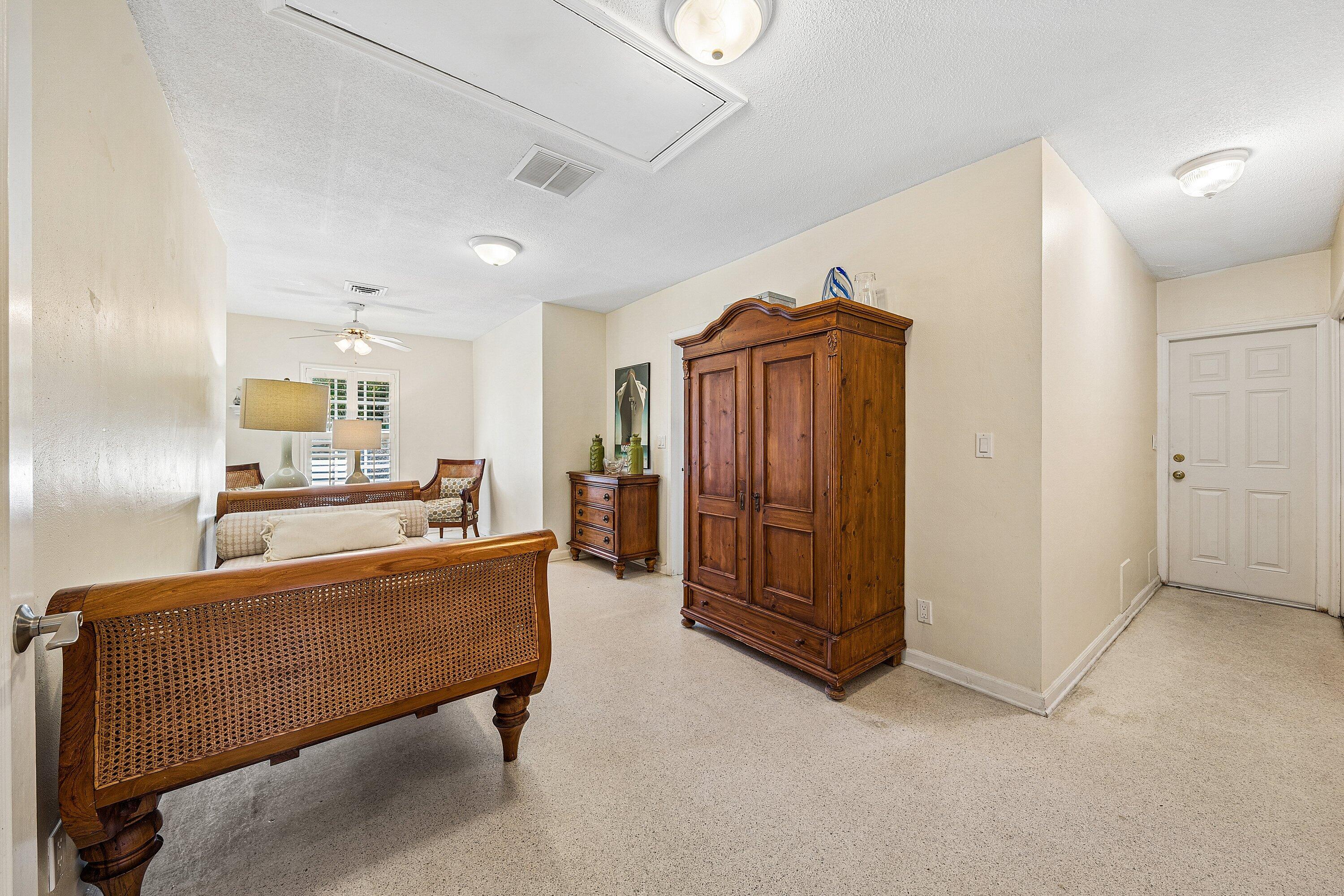 5550 Osprey Drive Ocean Ridge, FL 33435 - Photo 21 of 44 a living room with a couch and a refrigerator