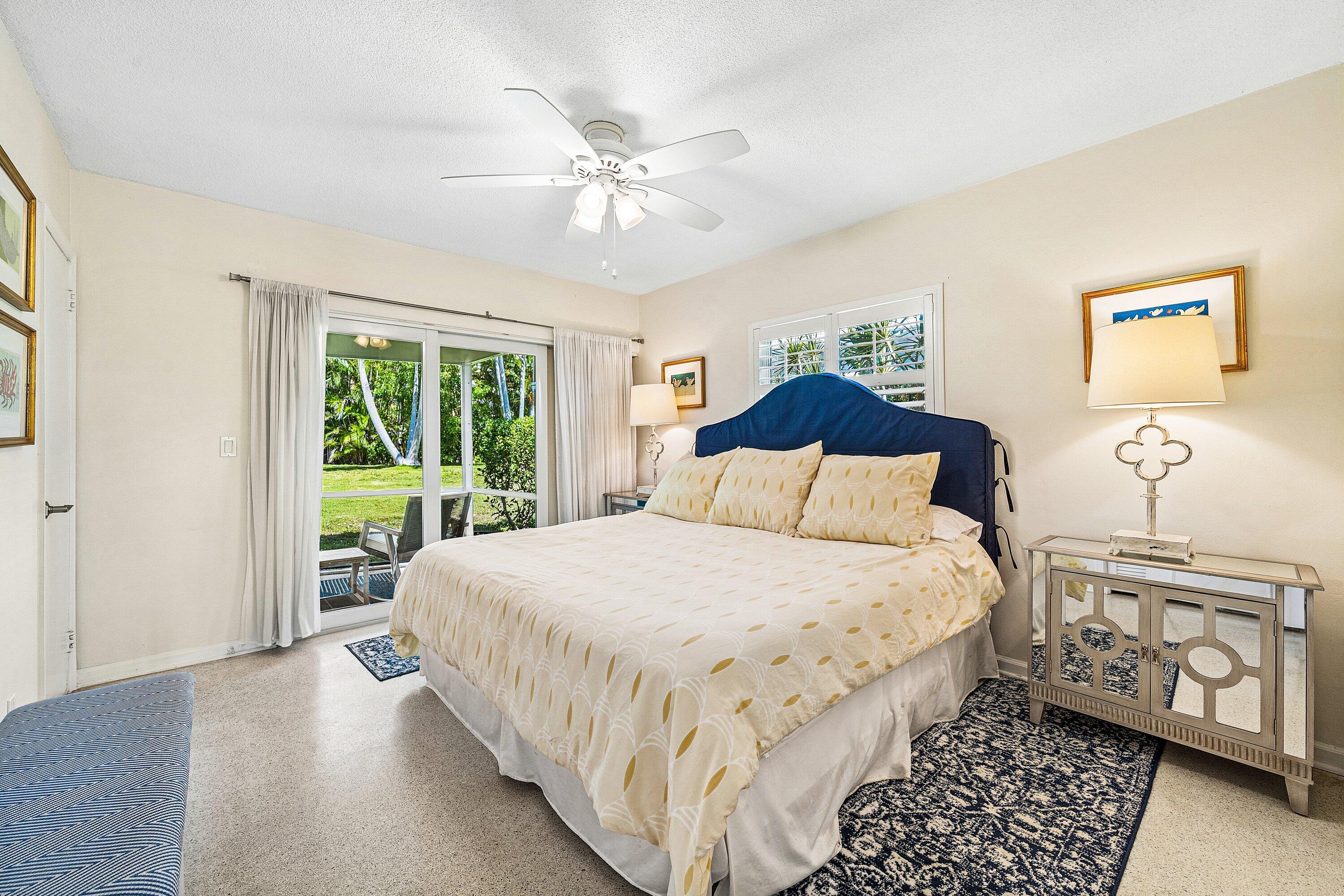 5550 Osprey Drive Ocean Ridge, FL 33435 - Photo 24 of 44 a bedroom with a large bed and a window