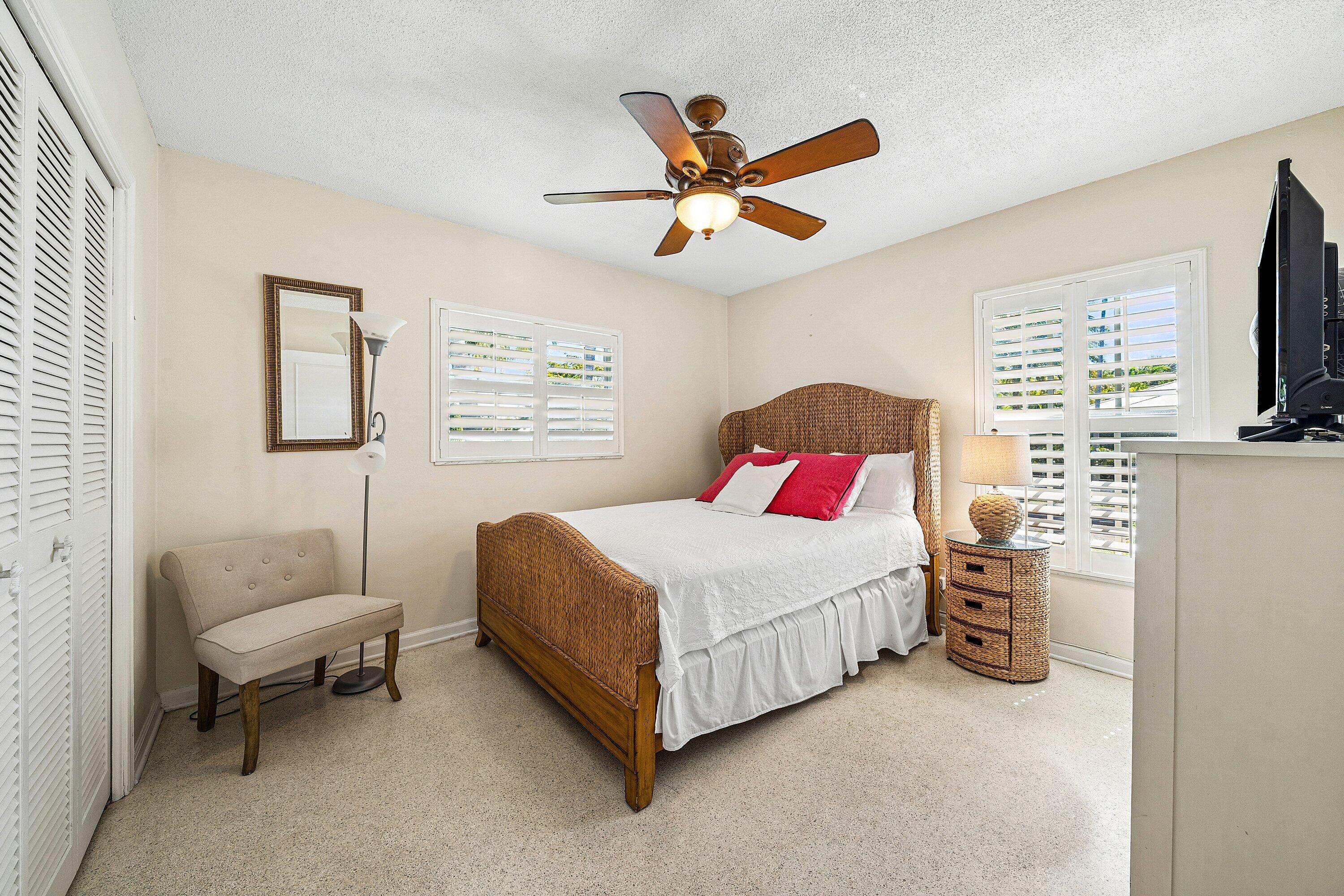 5550 Osprey Drive Ocean Ridge, FL 33435 - Photo 27 of 44 a bedroom with a bed furniture and a window