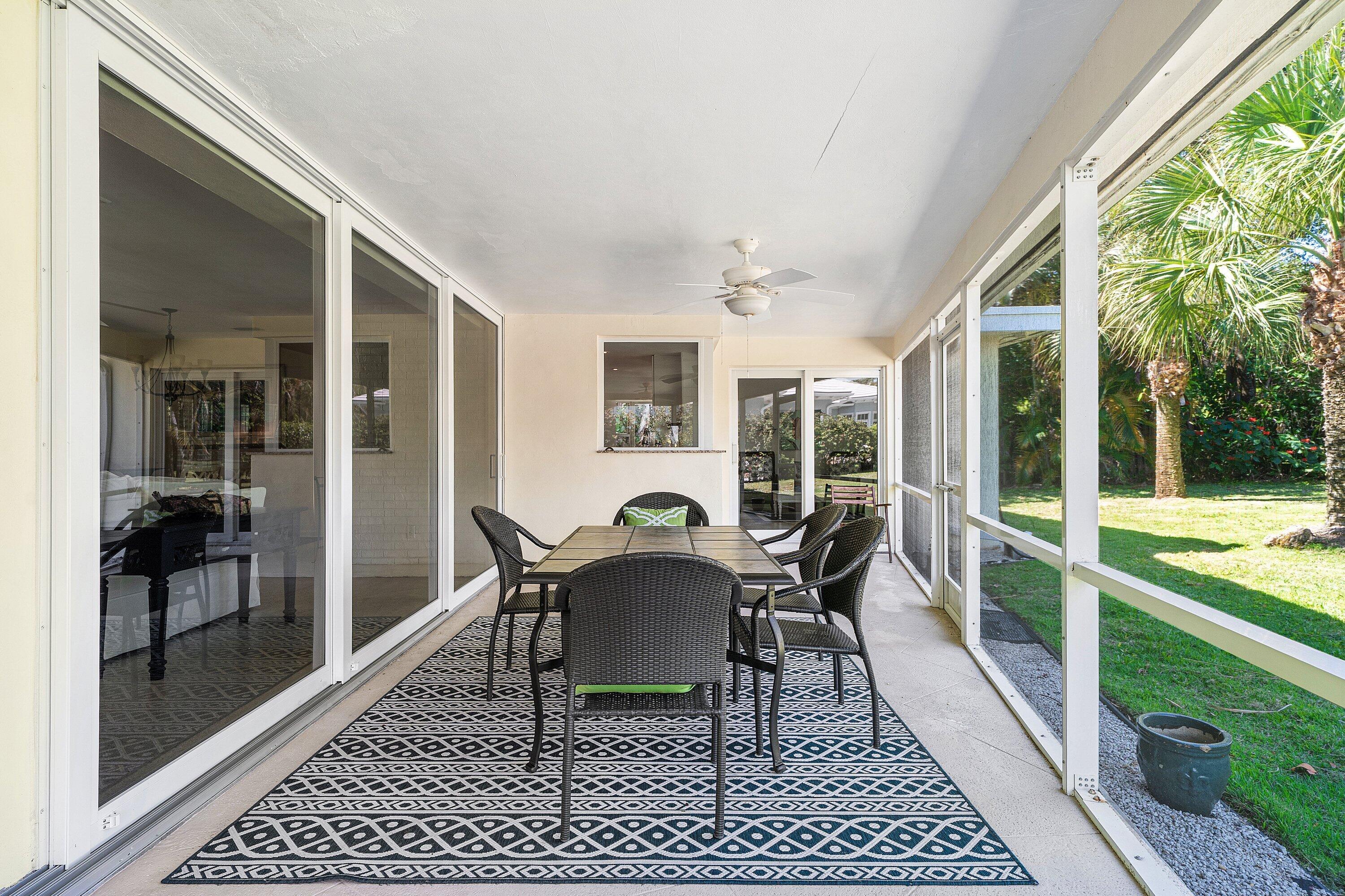 5550 Osprey Drive Ocean Ridge, FL 33435 - Photo 33 of 44 a dining room with furniture and wooden deck