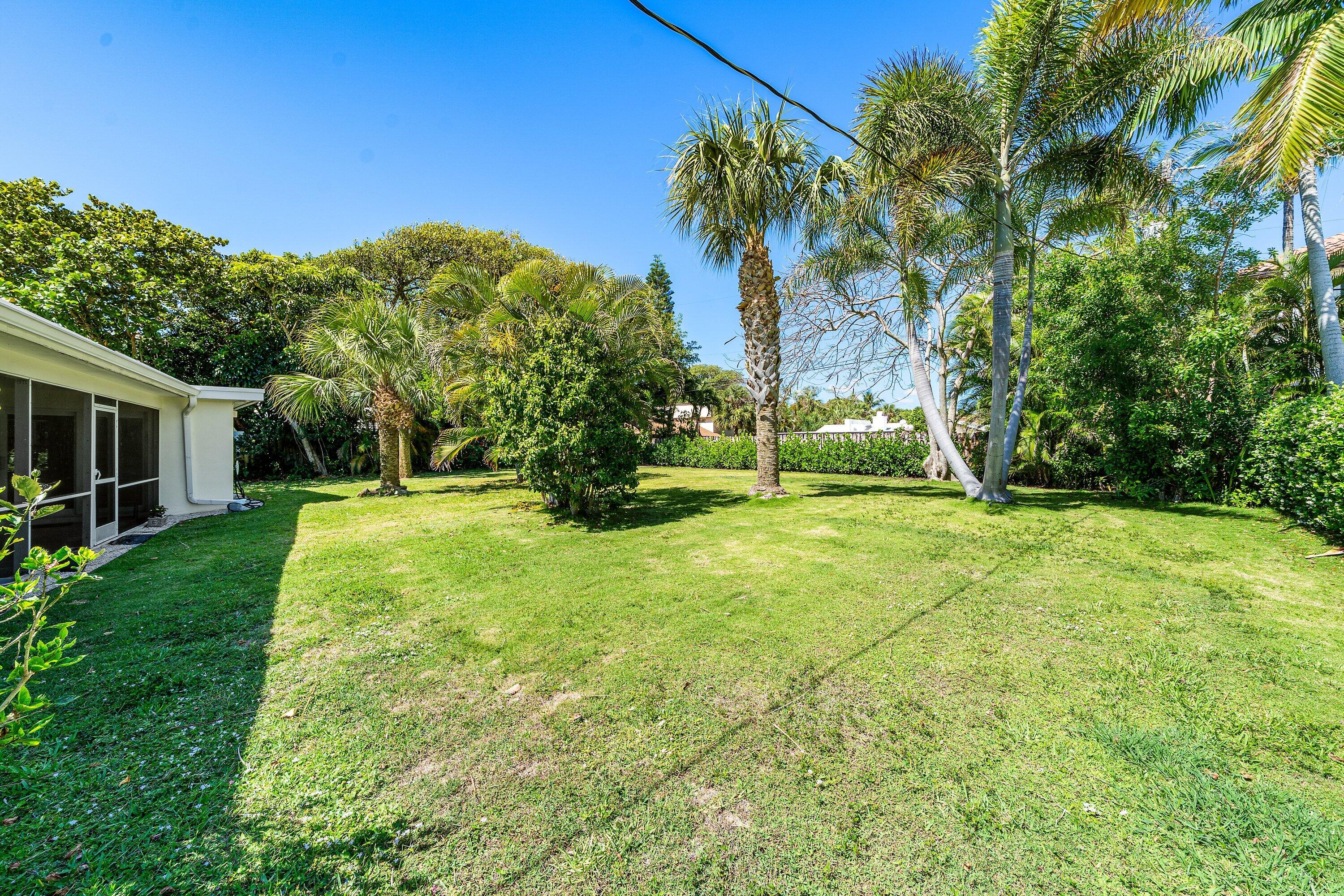 5550 Osprey Drive Ocean Ridge, FL 33435 - Photo 34 of 44 a view of a backyard with a garden