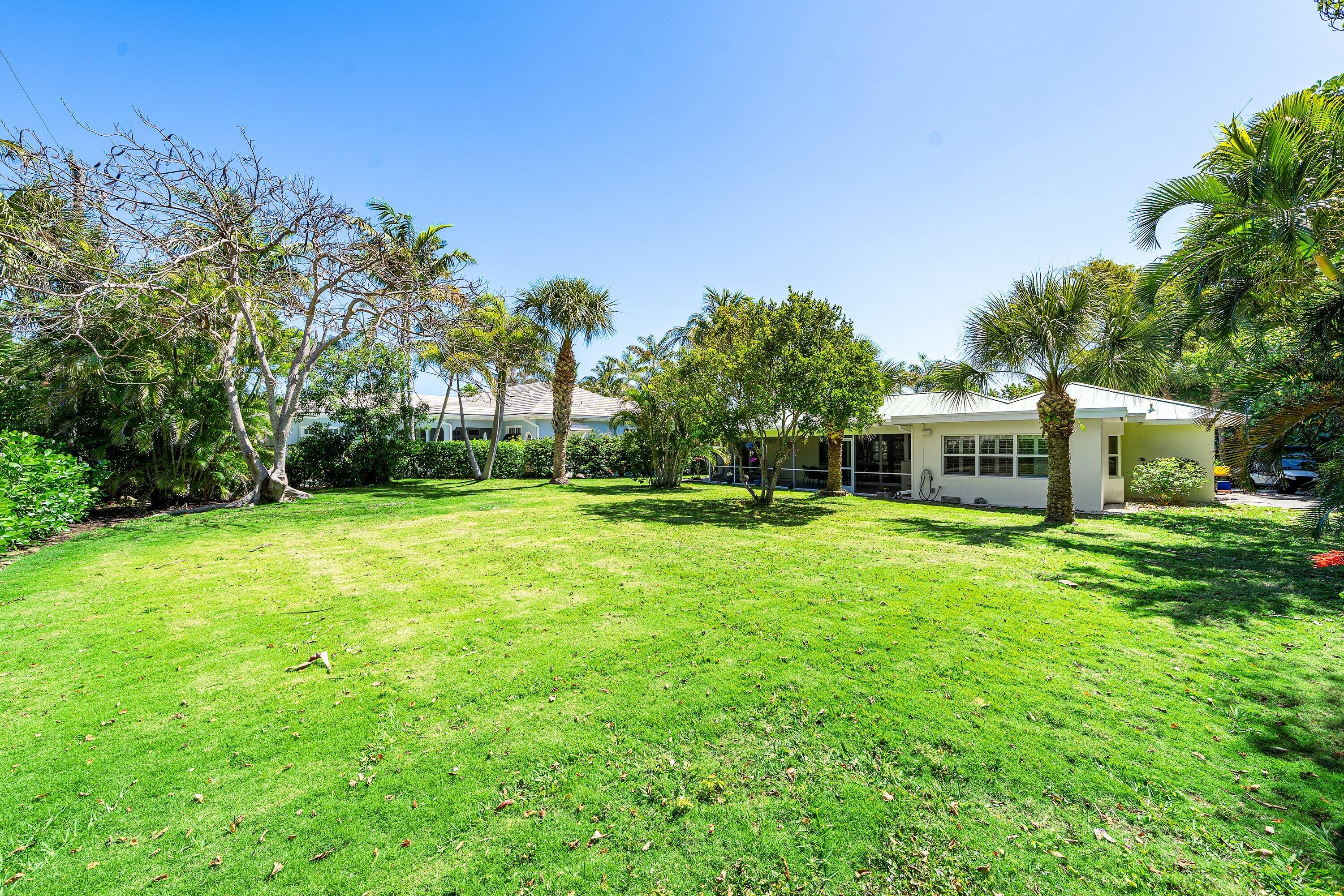 5550 Osprey Drive Ocean Ridge, FL 33435 - Photo 35 of 44 a front view of house with yard and green space