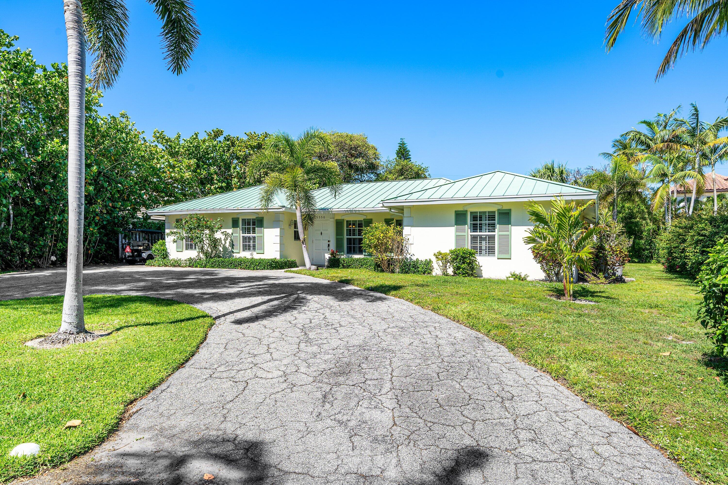 5550 Osprey Drive Ocean Ridge, FL 33435 - Photo 5 of 44 a view of a house with a yard