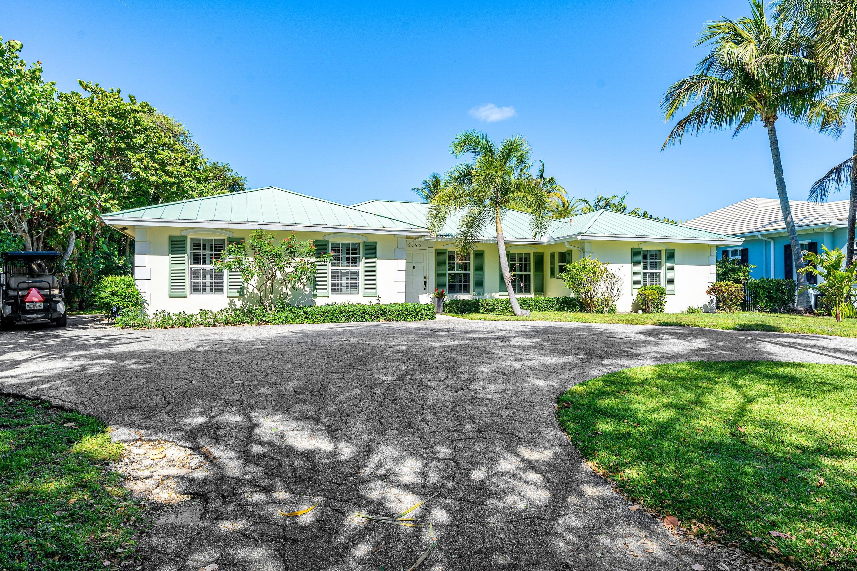 5550 Osprey Drive Ocean Ridge, FL 33435 - Photo 6 of 44 front view of a house with a yard