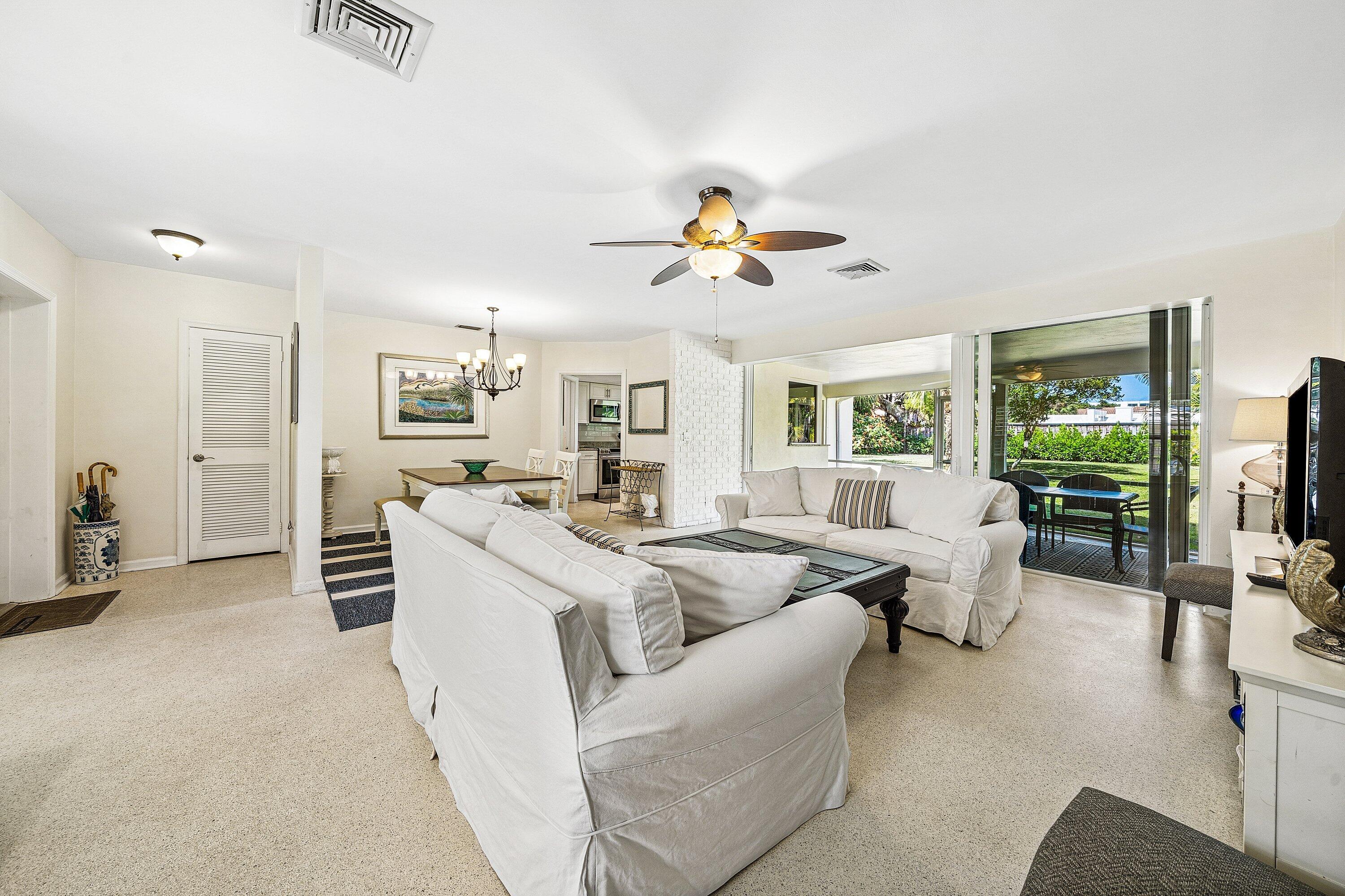 5550 Osprey Drive Ocean Ridge, FL 33435 - Photo 9 of 44 a living room with furniture and a flat screen tv