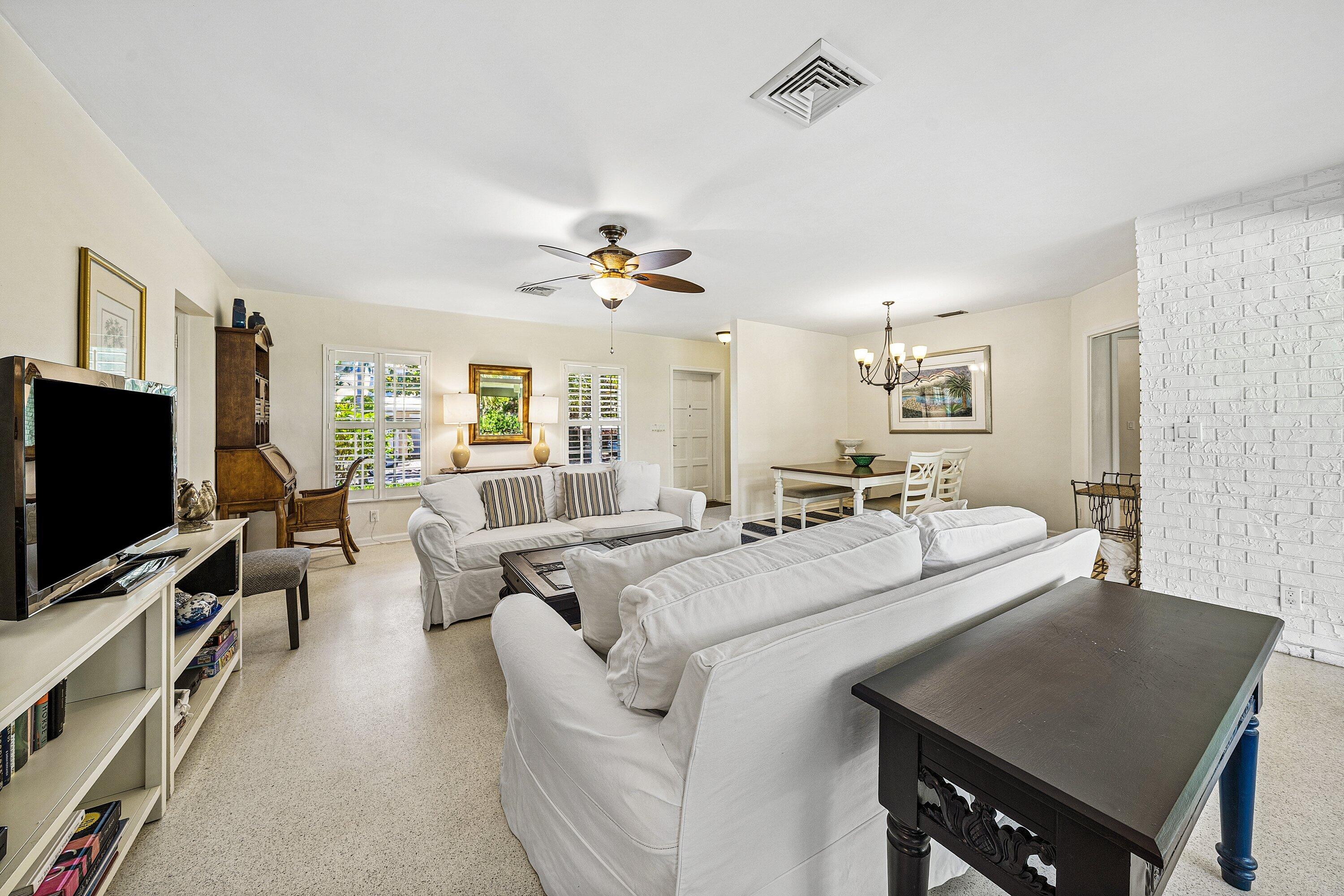 5550 Osprey Drive Ocean Ridge, FL 33435 - Photo 10 of 44 a living room with furniture and a flat screen tv