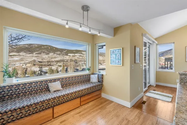 a spacious bedroom with a bed and a large window