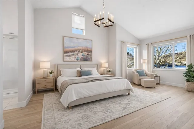 a bedroom with a large bed and a couch