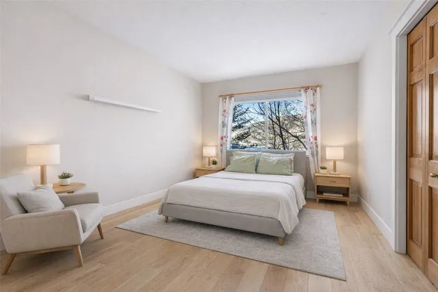 a bedroom with a bed and a couch