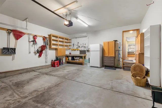 a view of washer and dryer with kitchen view