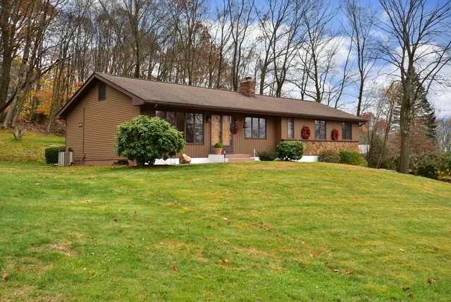 a front view of a house with garden