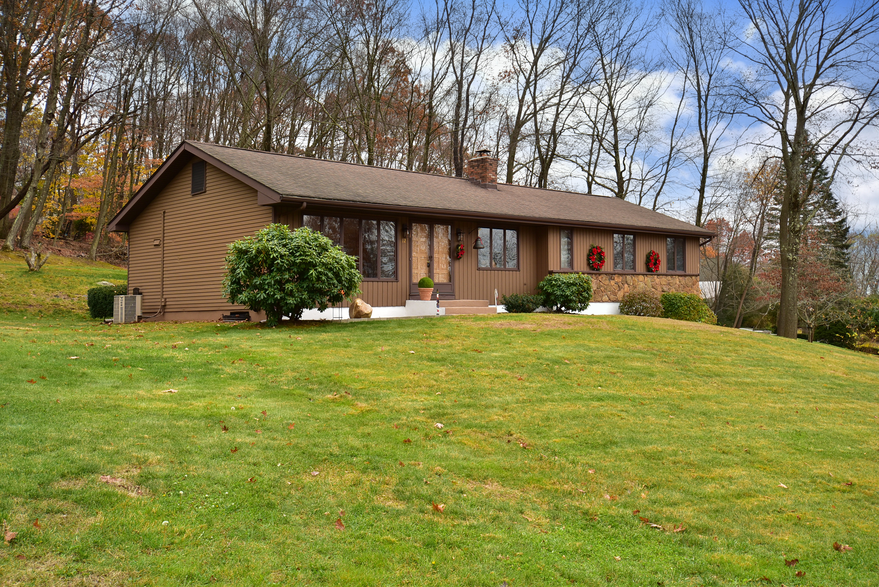 a front view of a house with garden