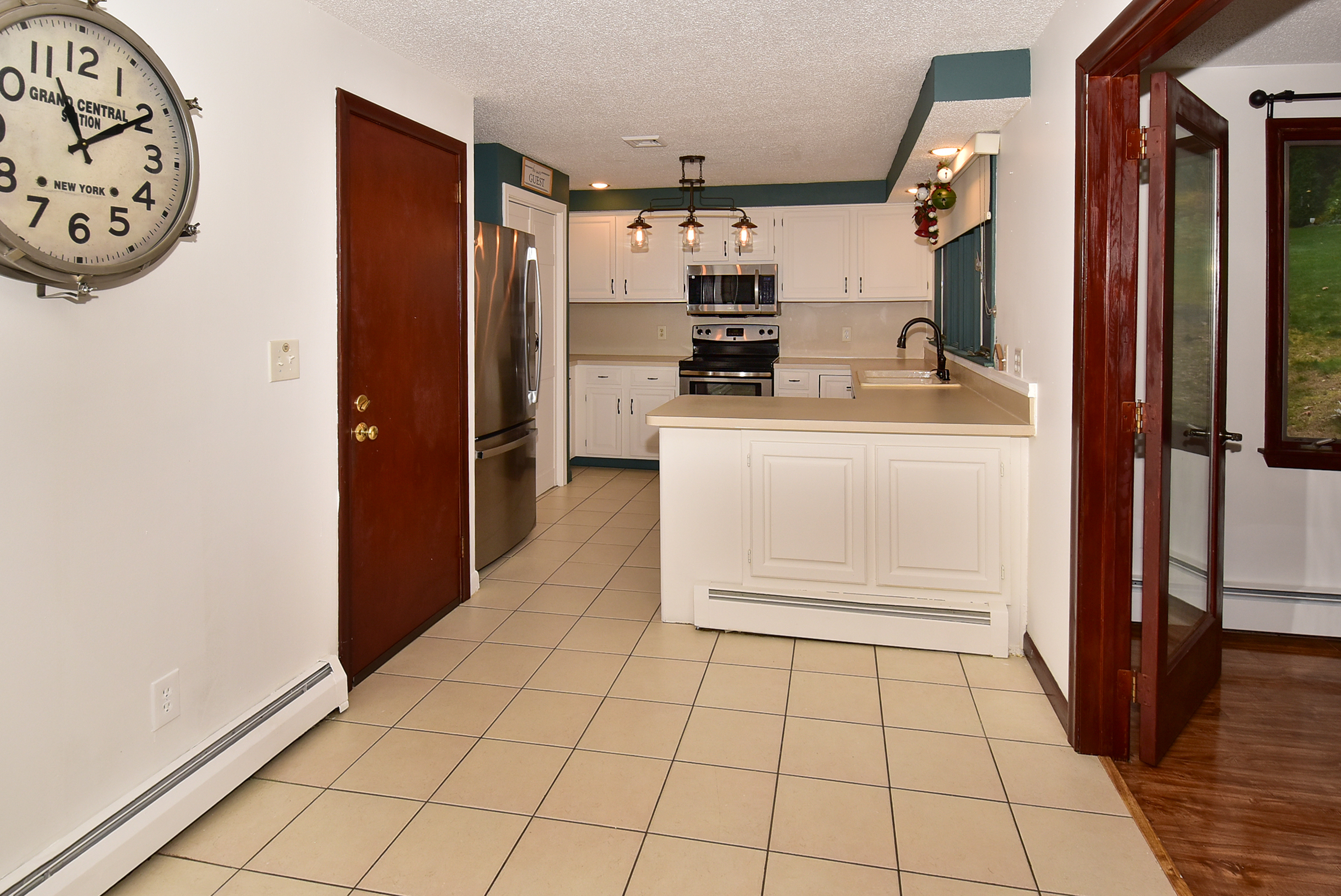 12 Austin Drive Vernon, CT 06066 - Photo 11 of 33 a kitchen with stainless steel appliances a refrigerator and cabinets
