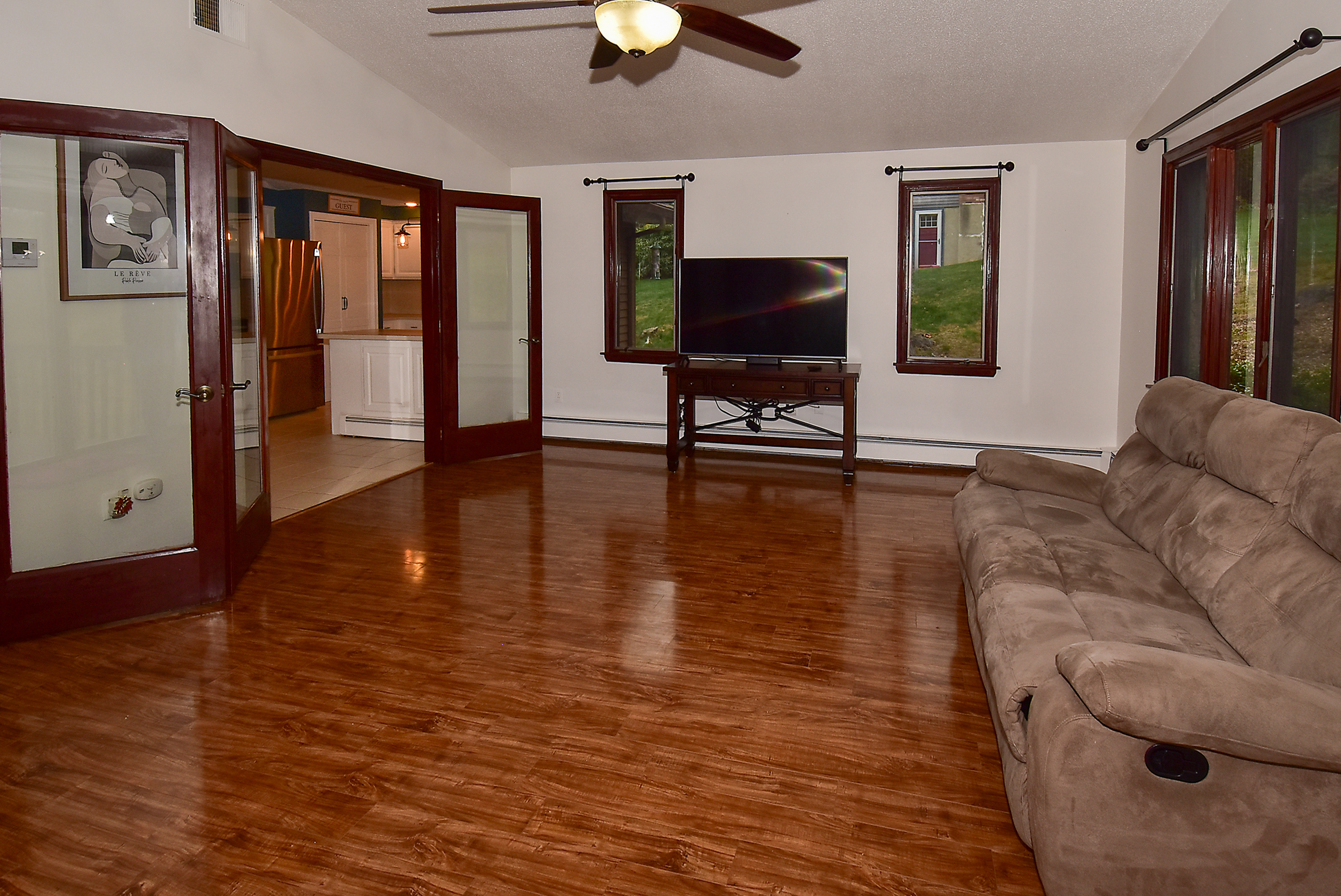 12 Austin Drive Vernon, CT 06066 - Photo 16 of 33 a living room with furniture and a flat screen tv with wooden floor