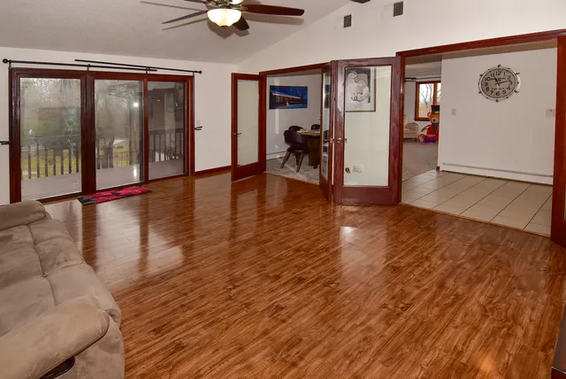 a view of an entryway with wooden floor