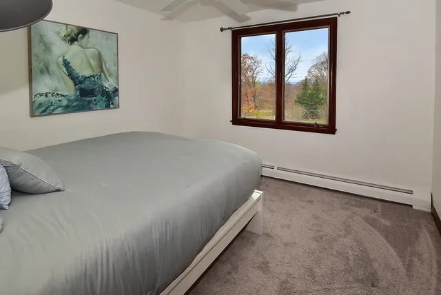 a view of a bedroom with a large window