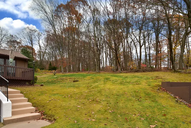 a swimming pool with trees in the background
