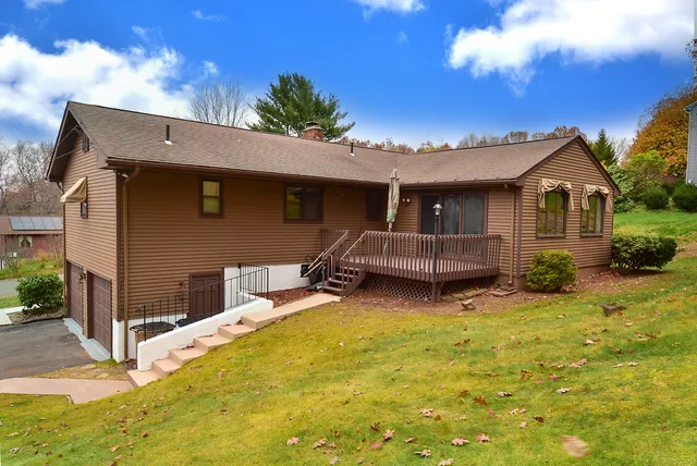 a backyard of a house with yard and garage