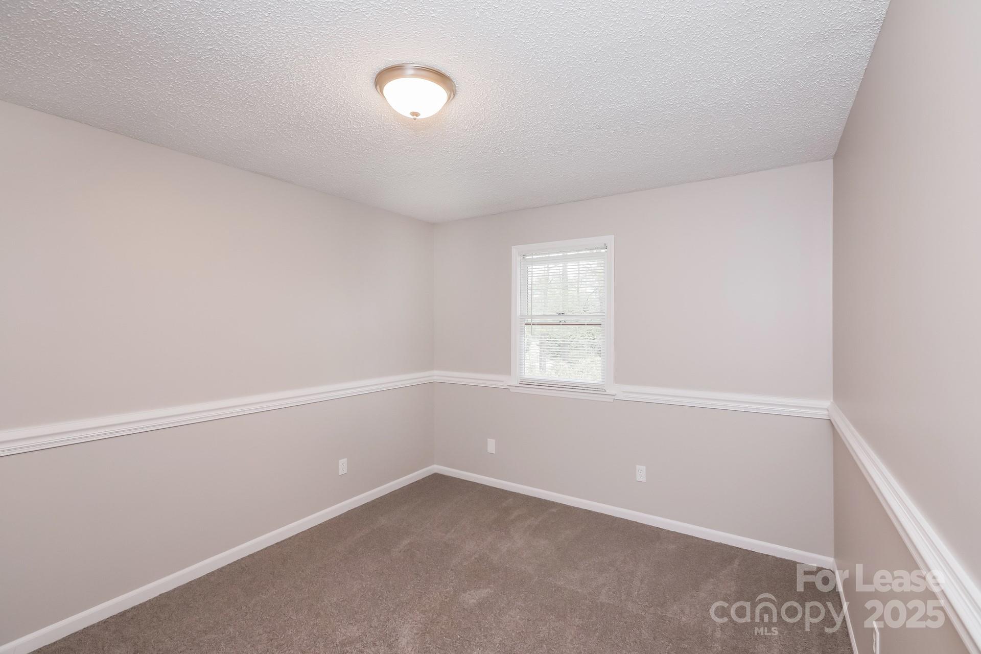 826 Potter Road Monroe, NC 28110 - Photo 14 of 17 an empty room with a window