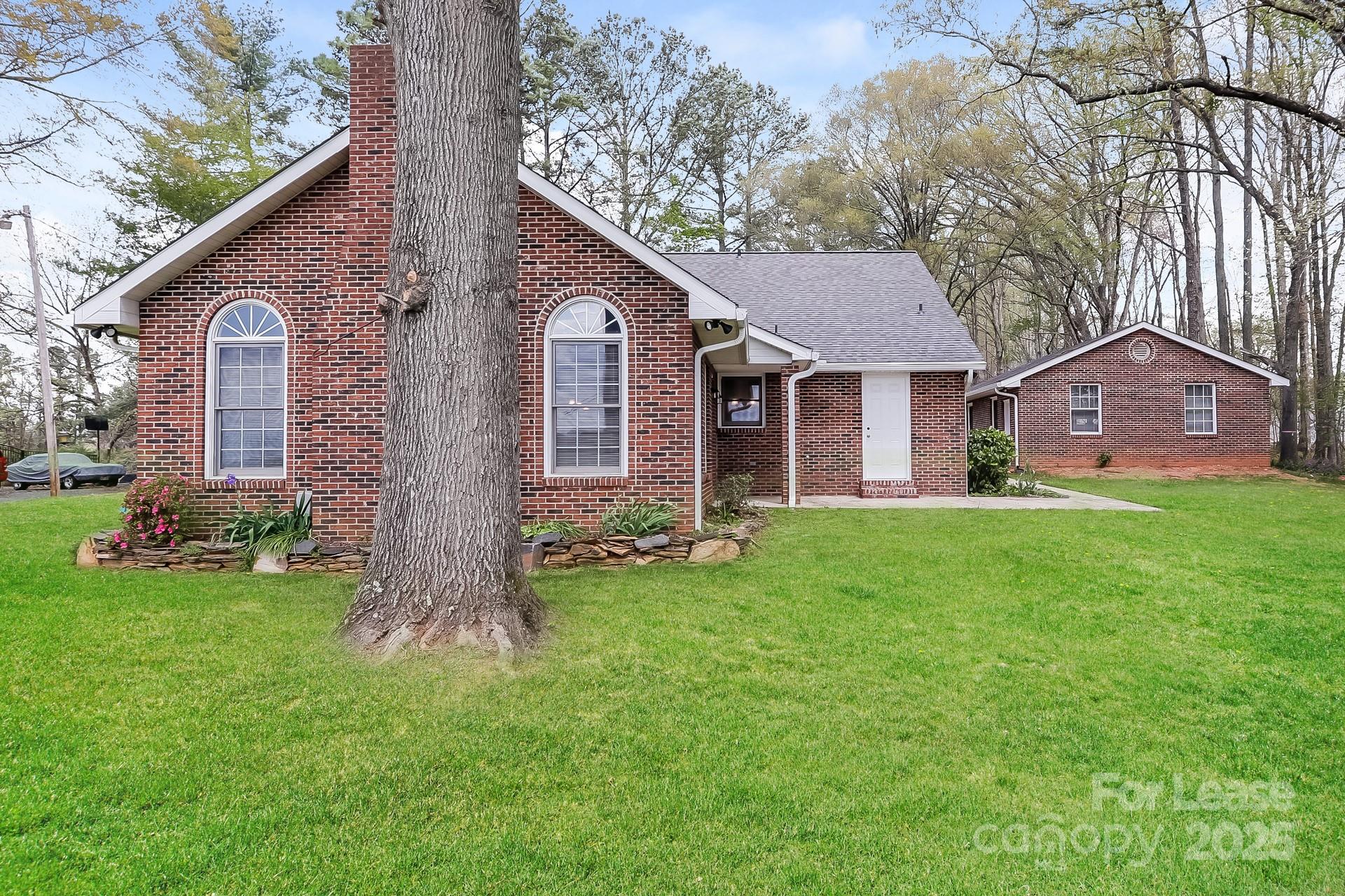 826 Potter Road Monroe, NC 28110 - Photo 17 of 17 a front view of a house with a garden