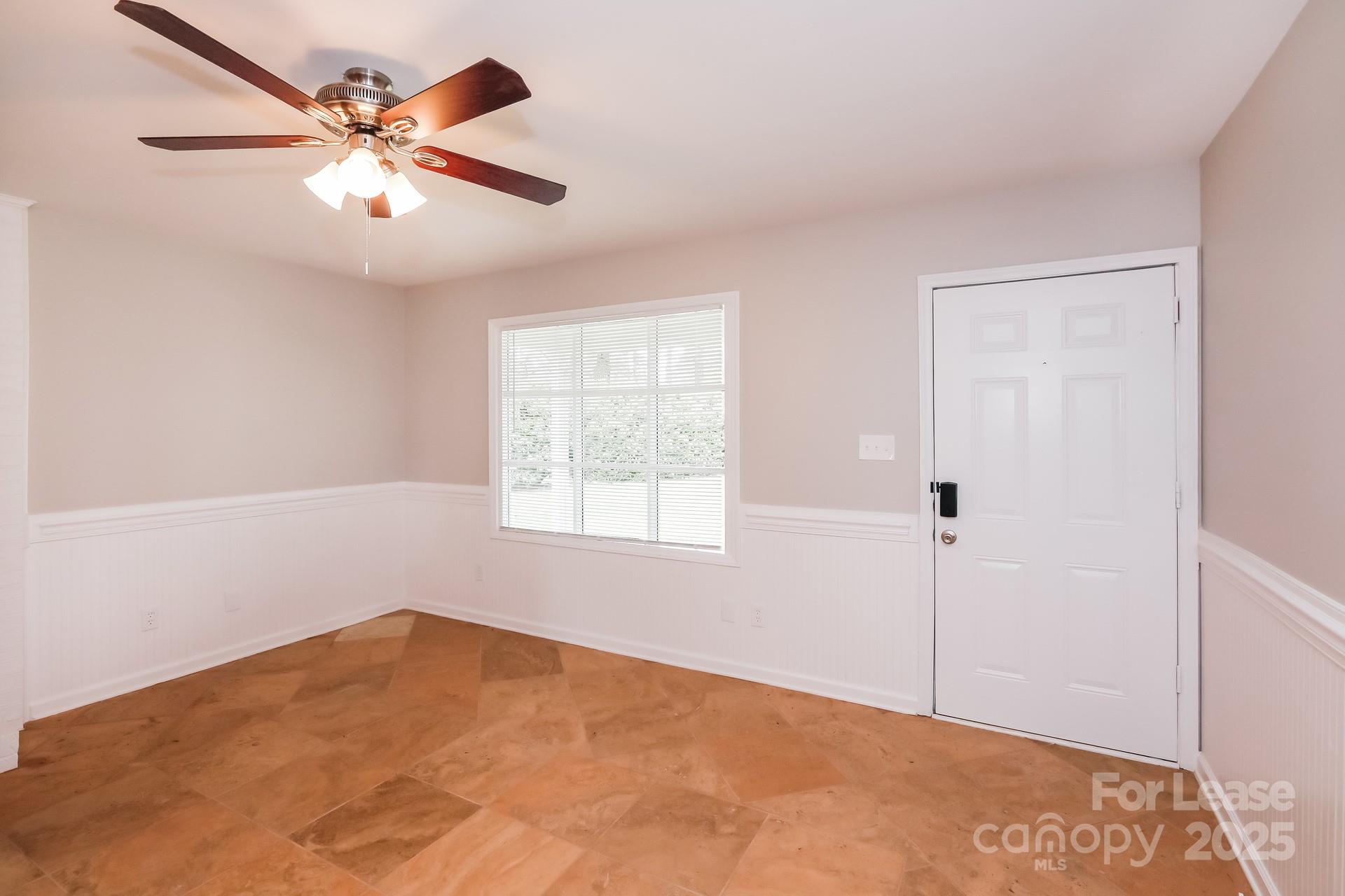 826 Potter Road Monroe, NC 28110 - Photo 10 of 17 a view of an empty room with a window