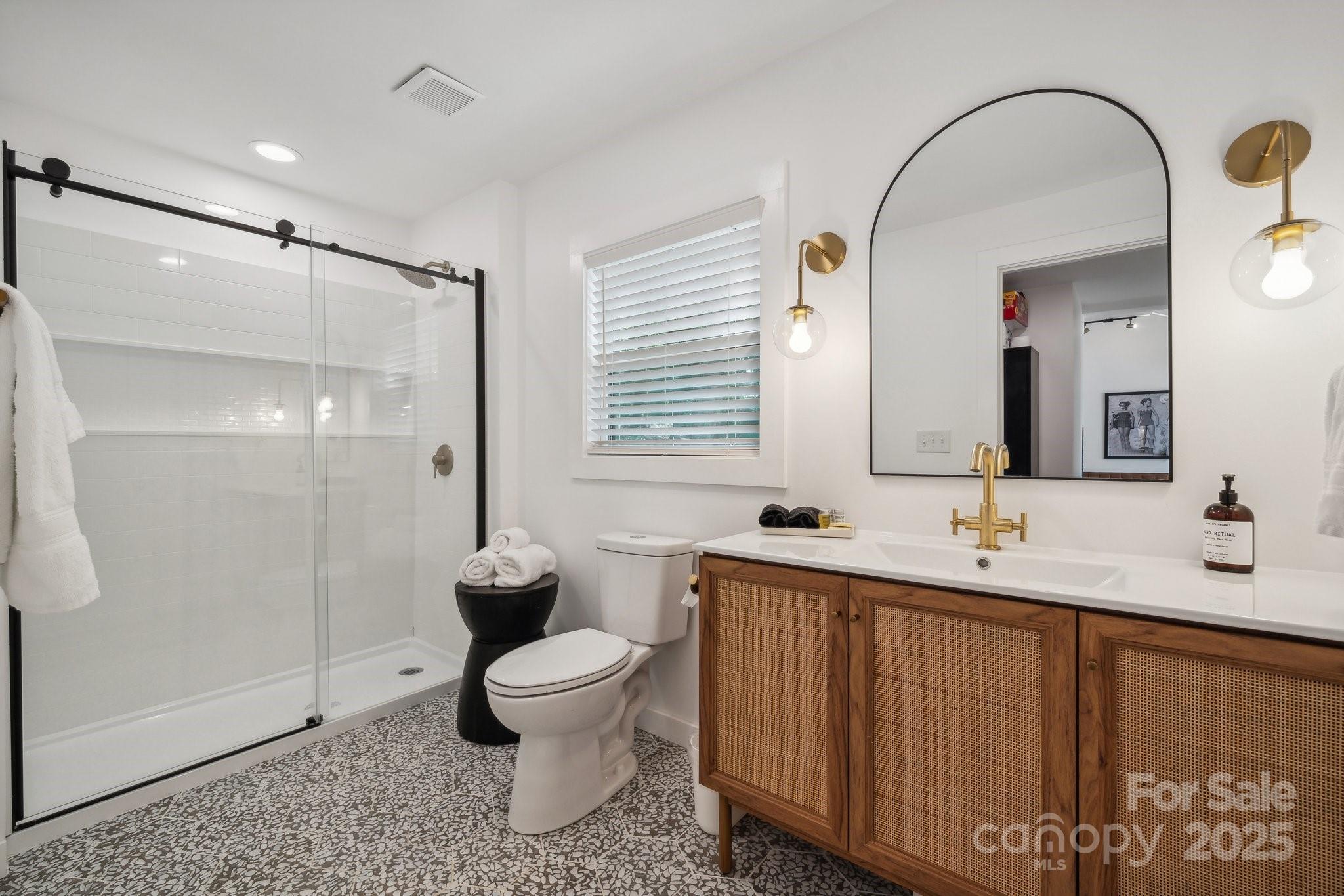 254 South Fork Road Mooresville, NC 28117 - Photo 12 of 34 a bathroom with a double vanity sink toilet and shower