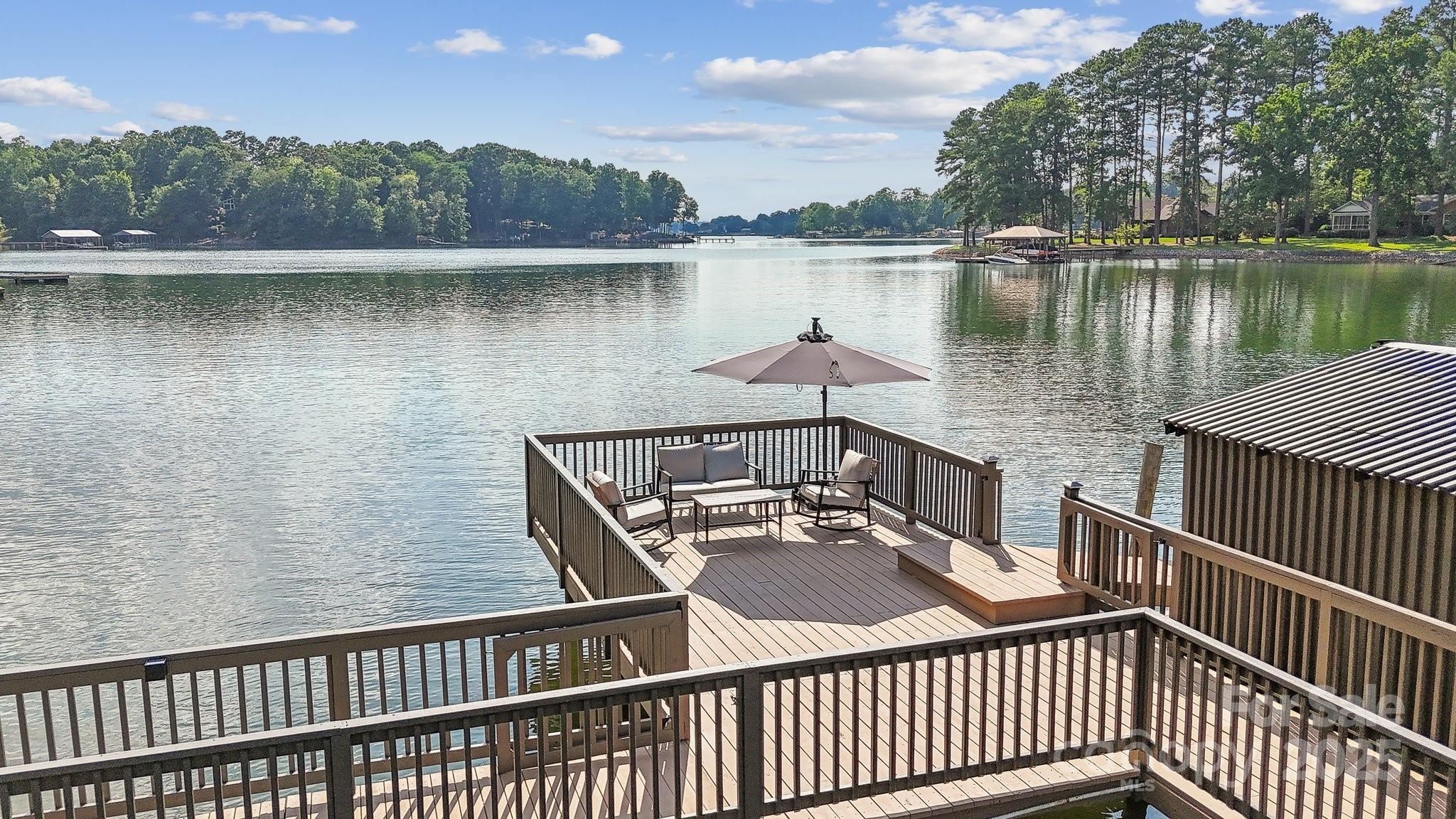 254 South Fork Road Mooresville, NC 28117 - Photo 23 of 34 a view of a lake with a deck