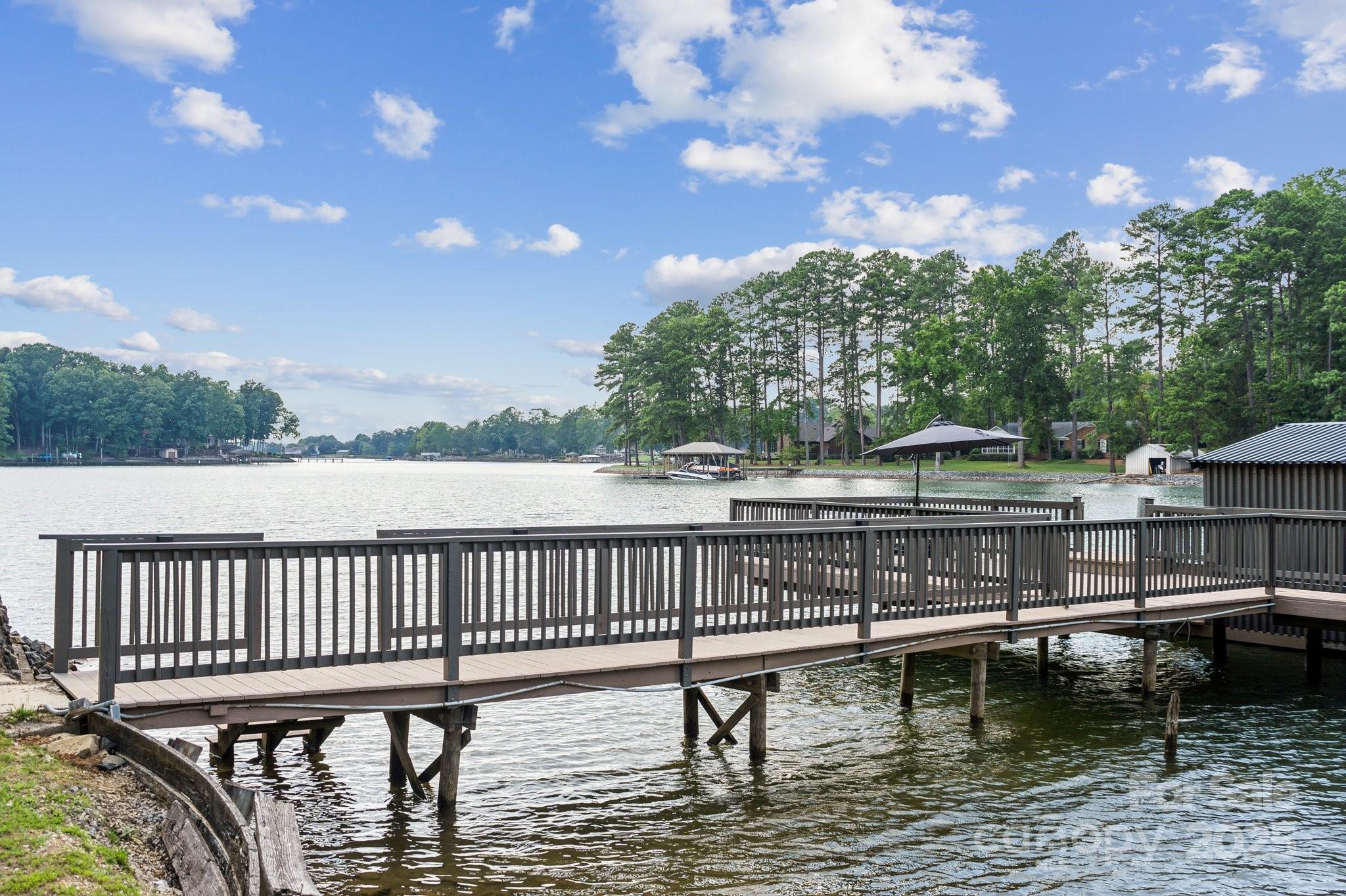 254 South Fork Road Mooresville, NC 28117 - Photo 24 of 34 a view of house with swimming pool and outdoor seating