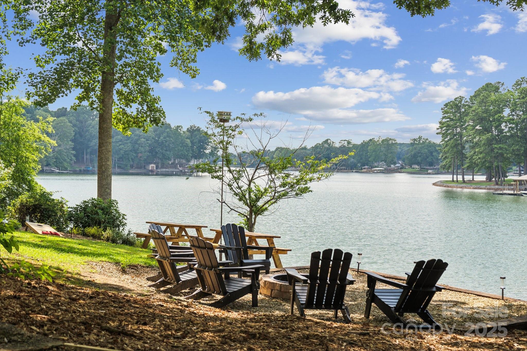 254 South Fork Road Mooresville, NC 28117 - Photo 26 of 34 a view of a lake with table and chairs